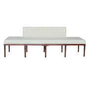A long upholstered bench with a tufted beige Velvet backrest and seat cushion, supported by a dark brown wooden frame with turned legs.