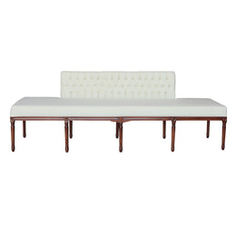 A long upholstered bench with a tufted beige Velvet backrest and seat cushion, supported by a dark brown wooden frame with turned legs.