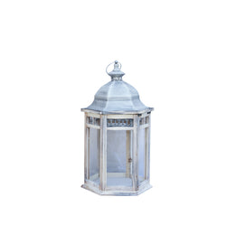 Decorative lantern with a metallic top on a white background