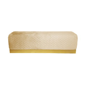 Beige quilted bench with gold trim on a white background