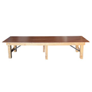 Wooden table with a dark brown top and light wooden legs on a white background