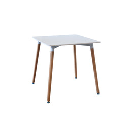 Square table with white top and wooden legs on a white background