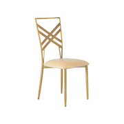 Gold chair with a geometric back design on a white background