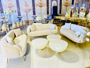 Luxurious interior with cream-colored sofas and tables in a decorated room.