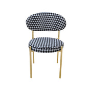 Chair with black and white houndstooth pattern on a white background