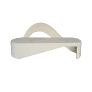 White wall-mounted shelf with a curved design on a white background