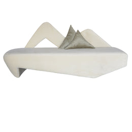 Beige Velvet sofa with two pillows on a white background
