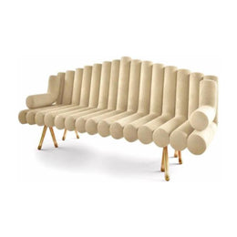 Beige curved sofa with wooden legs on a white background