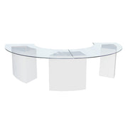 Clear glass dining table with white legs on a white background