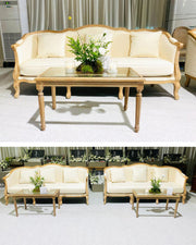 Beige sofa set with a coffee table in a showroom setting