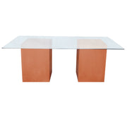 Modern glass-top desk with orange cube-shaped legs on a white background