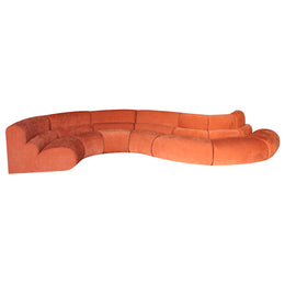 Orange curved sofa on a white background
