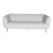 A modern three-seater sofa upholstered in white leather with vertical channel tufting, flared rounded arms, and slim gold metal legs, shown against a plain white background.