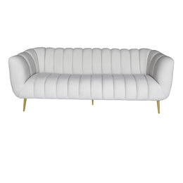 A modern three-seater sofa upholstered in white leather with vertical channel tufting, flared rounded arms, and slim gold metal legs, shown against a plain white background.
