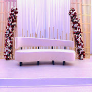 Beige sofa with floral decorations on a white background
