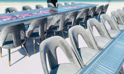 Moments Rentals Modern outdoor furniture set with tables and chairs on a bright day.