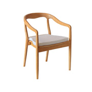 Moments Rentals Wooden chair with a white cushion on a white background