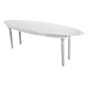 White oval table with turned legs on a white background moments rentals