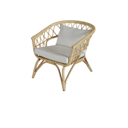 Wicker chair with white cushions on a white background