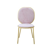 Pink velvet chair with gold frame on a white background
