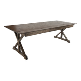 Wooden dining table with X-shaped legs on a white background