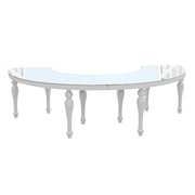 White curved table with glass top on a white background