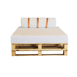 Wooden pallet sofa with white cushions and a striped pillow on a white background