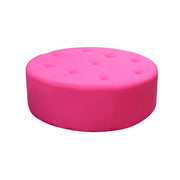 Pink round ottoman on a white background
