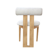A modern wooden chair with a textured, bouclé-look White upholstered backrest and seat cushion, supported by two vertical natural wood legs with a U-shaped base.