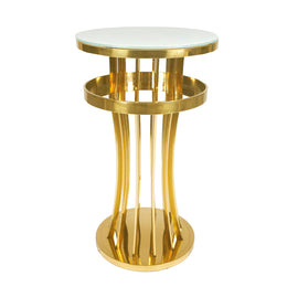 Gold cocktail table with a glass top on a white background