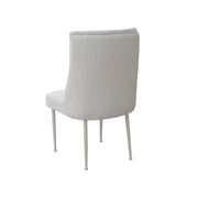 beige velvet chair with ribbed backrest on a white background