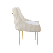 Beige chair with white cushion and gold legs on a white background