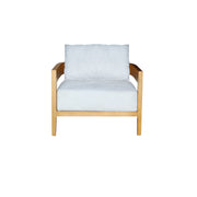 A modern armchair with a light natural wood frame and plush, light blue-gray cushions on the seat and backrest, shown against a plain white background.