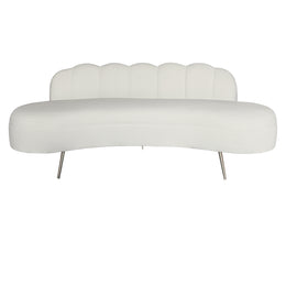 A modern curved Beige velvet upholstered bench with a scalloped backrest and slim metallic legs.