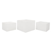 Three white cube-shaped Tables on a white background
