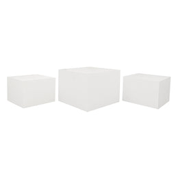 Three white cube-shaped Tables on a white background