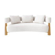 White sofa with oak wooden legs on a white background