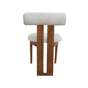 Wooden stool with a cushioned seat and backrest on a white background