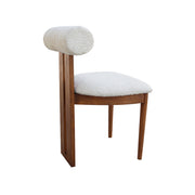 Chair with wooden frame and white cushioned seat and backrest on a white background