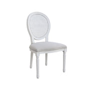 White chair with a caned backrest on a white background