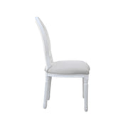 Chair with green cushioned seat and wooden frame on a white background
