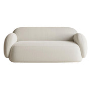Beige sofa with curved design on a white background
