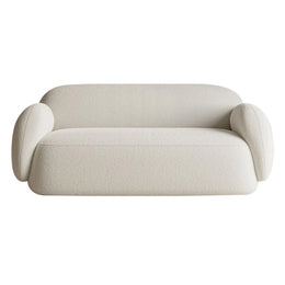 Beige sofa with curved design on a white background
