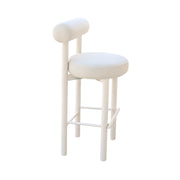 Beige bar stool with cushioned seat on a white background