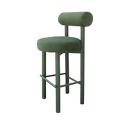 Green bar stool with cushioned seat and backrest on a white background