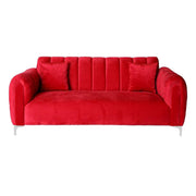 Red sofa with tufted backrest on a white background