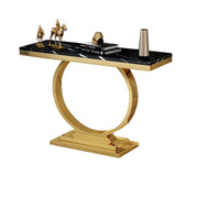 Decorative console table with gold base and black marble top on a white background