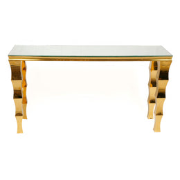 Gold console table with a white marble top on a white background