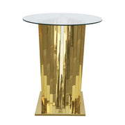 A modern cocktail table with a clear glass top and a reflective gold pedestal base, shown on a plain white background.