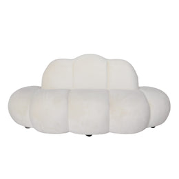 A modern cloud-shaped sofa beige velvet upholstery 